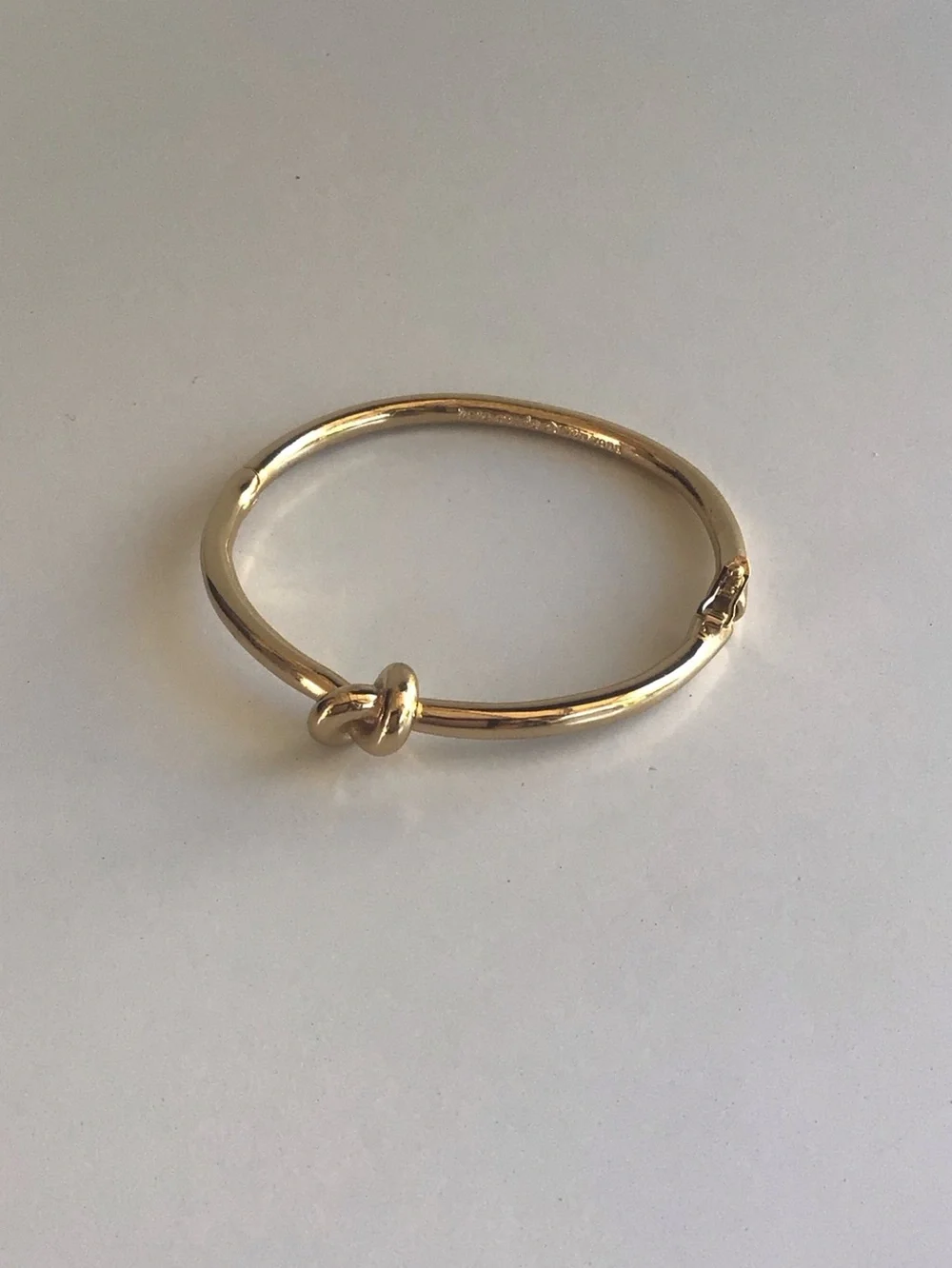 Kate Spade gold knot bangle bracelet
